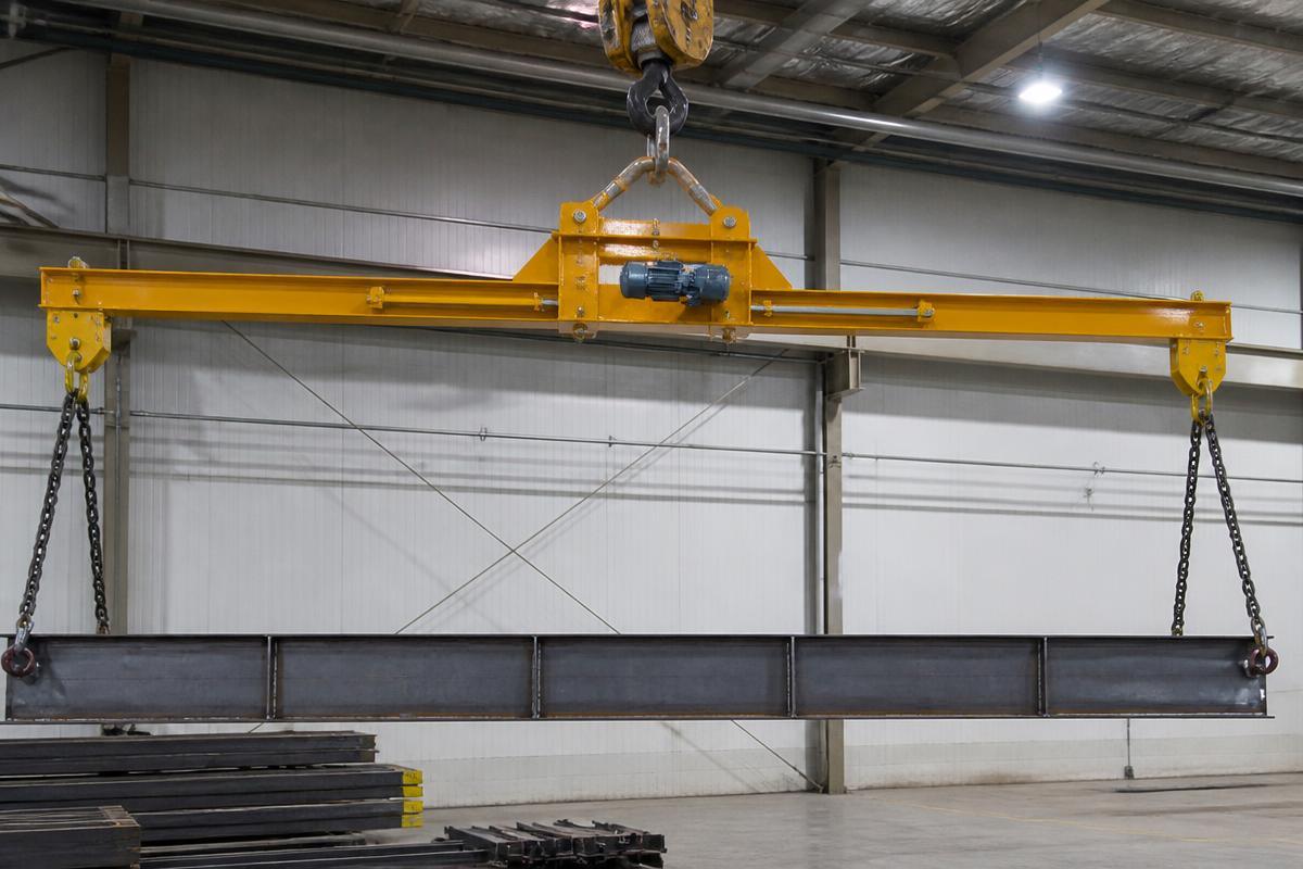 Motorized engineered spreader lifting device on an overhead crane